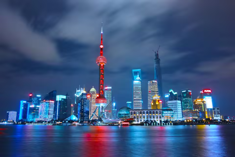 Shanghai financial district skyline illuminated at night across the river