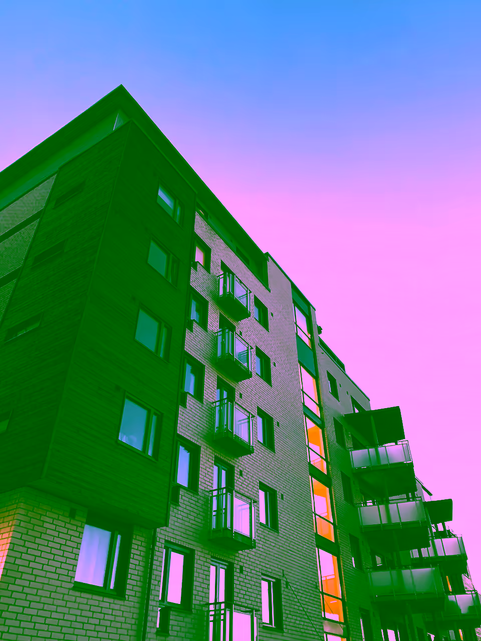Modern UK build-to-rent apartment building exterior with balconies