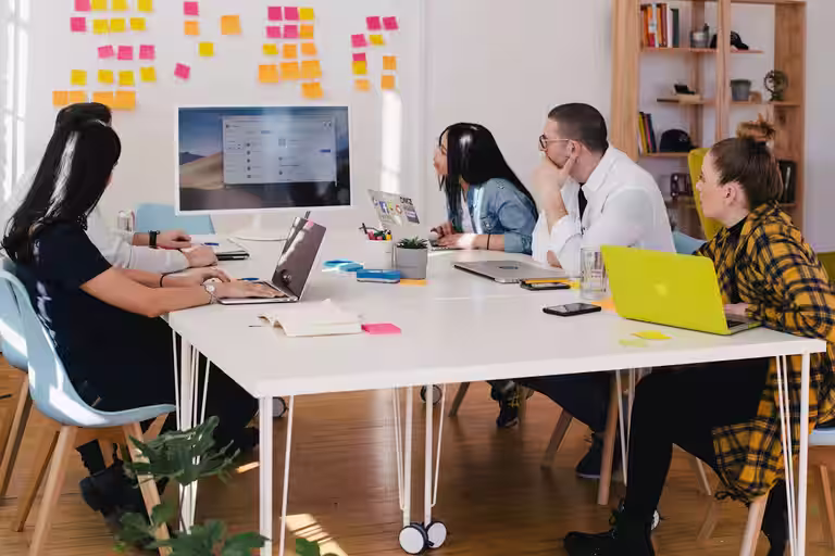 Marketing professionals collaborating on campaigns in a modern office